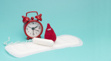 Photo of a pad, tampon and clock
