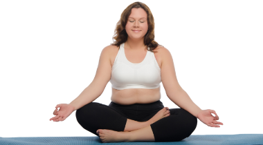 Woman sitting on a yoga mat meditating